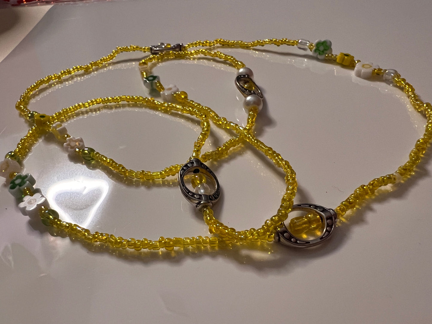 Yellow seed bead waistbeads with flower, pearl and metal charms