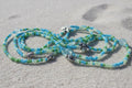 blend of green and light blue seed beeds accented with silver flowers, sea turtles