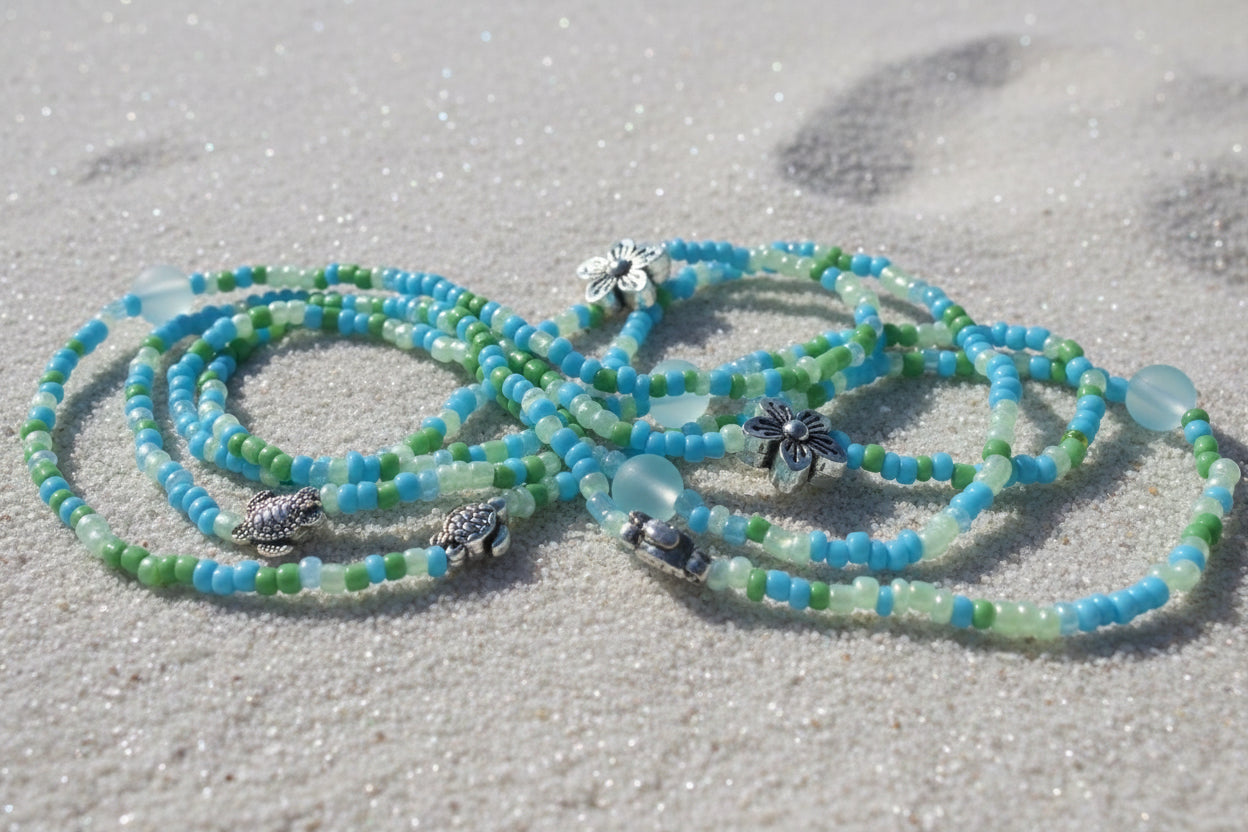 blend of green and light blue seed beeds accented with silver flowers, sea turtles