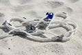 White waistbeads with evil eye hamsa hand and glass heart and accents of silver beads