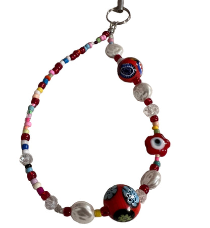 Beaded wristlet with colorful beads and decorative elements