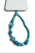 Beaded phone wristlet with blue and evil eye glass beads 