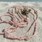 coral beads with gold sea charms