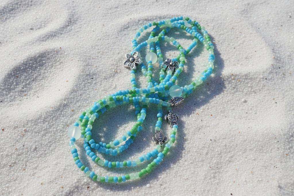 blend of green and light blue seed beeds accented with silver flowers, sea turtles