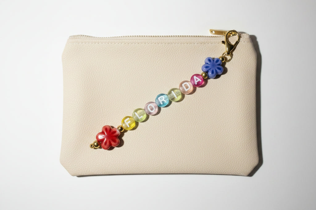 colorful beaded florida keychain with porcelain flower charms hanging from gold-tone chain 