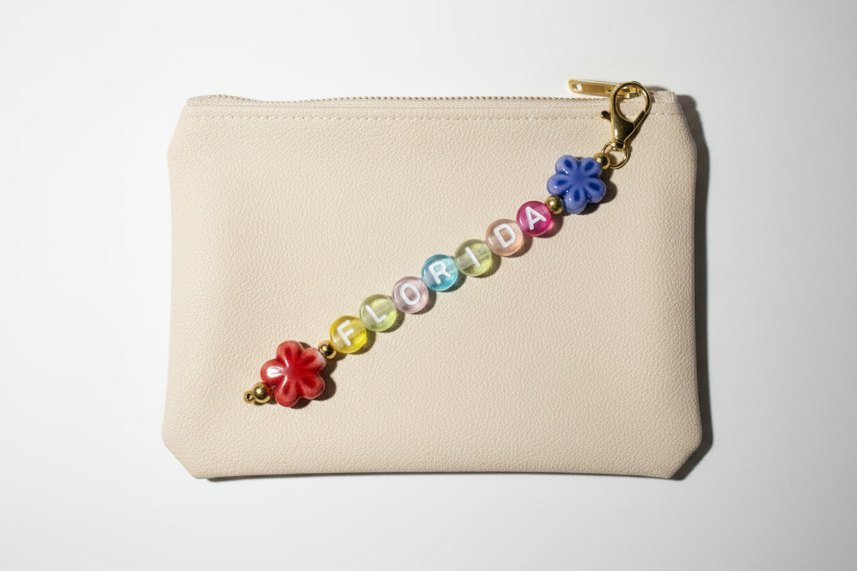 colorful beaded florida keychain with porcelain flower charms hanging from gold-tone chain 