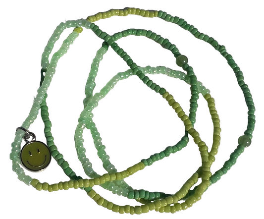 Green beaded waistbeads with a smiley face pendant