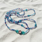 This set offers a beautiful blend of teal, purple, and blue beads. Accented with purple reflective flowers surrounded with leaves! So comfy, you won't even feel like you're wearing them!