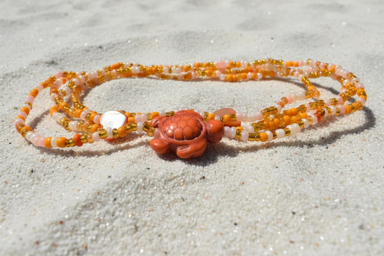 orange and cream waist beads with coral hearts and orange turtles