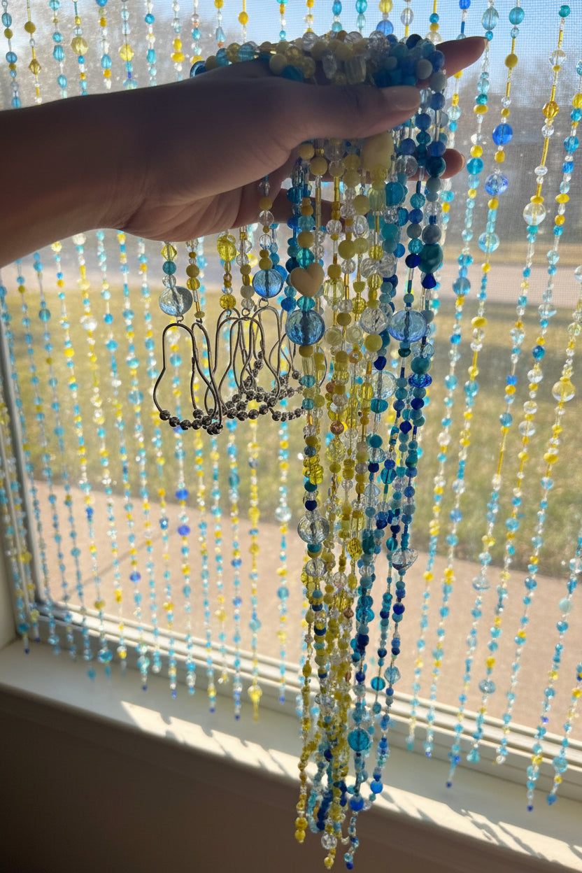 Hand holding a bundle of colorful beaded strands