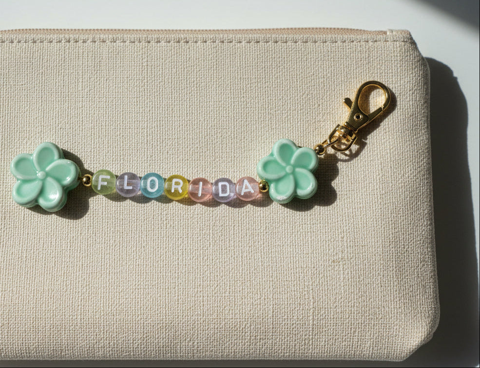 purse charm that spells florida with colorful repurposed beads