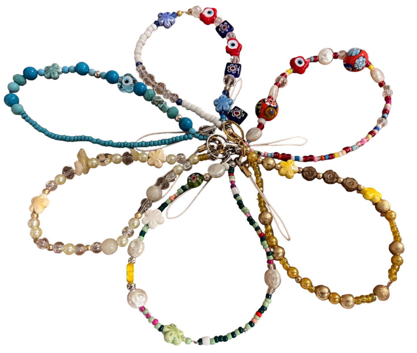 Colorful beaded wristlets on a wooden background