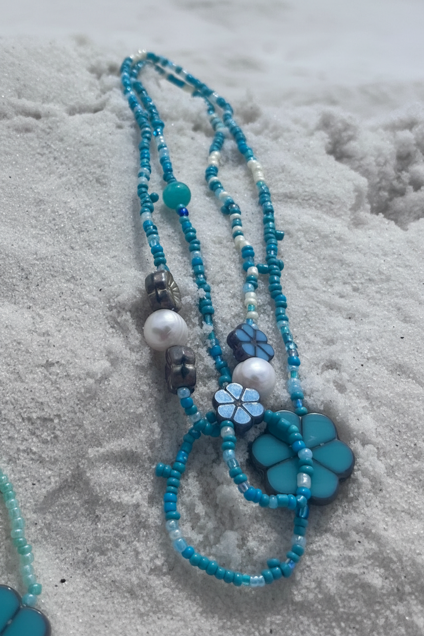 blue laguna waistbeads in sand