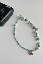 Beaded camera wristlet with pearls and blue turquoise beads